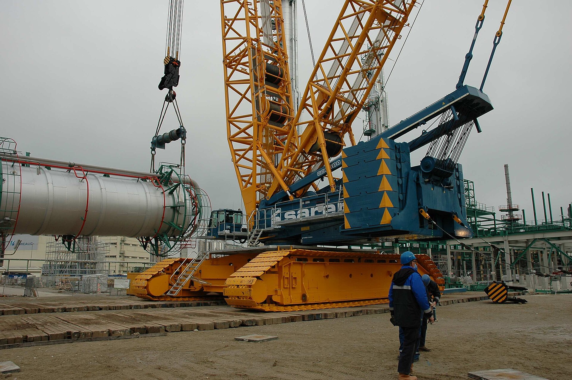 Telescopic crane boom rising against the sky